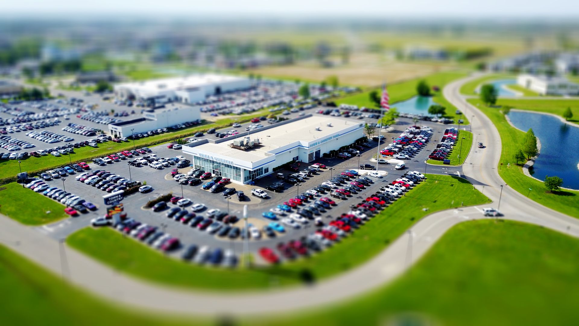 Aerial view of a large vehicle fleet arranged in an open outdoor area